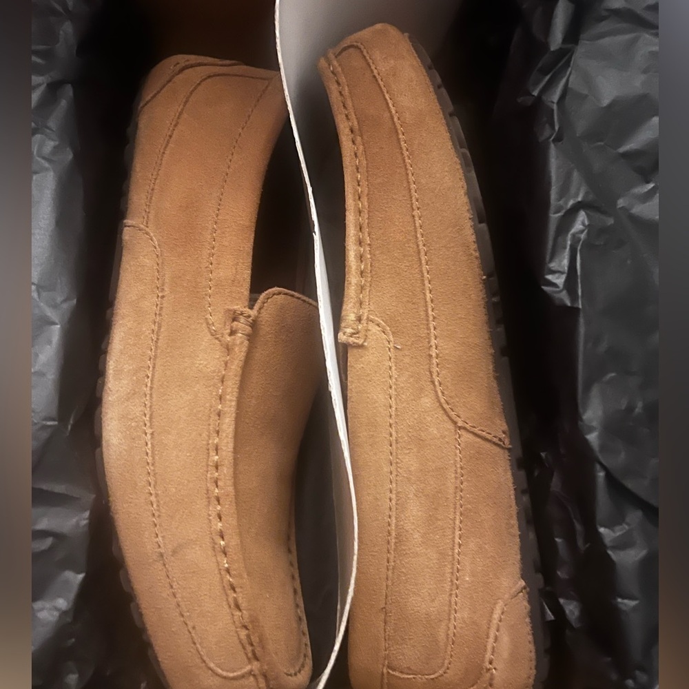 Size 13 used brown ugg loafers with the fur on the inner